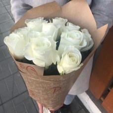 11 white roses in craft paper