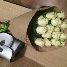 15 white roses in craft paper